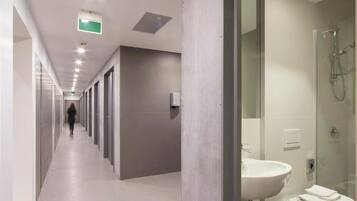 Shower, hair dryer, towels, toilet paper