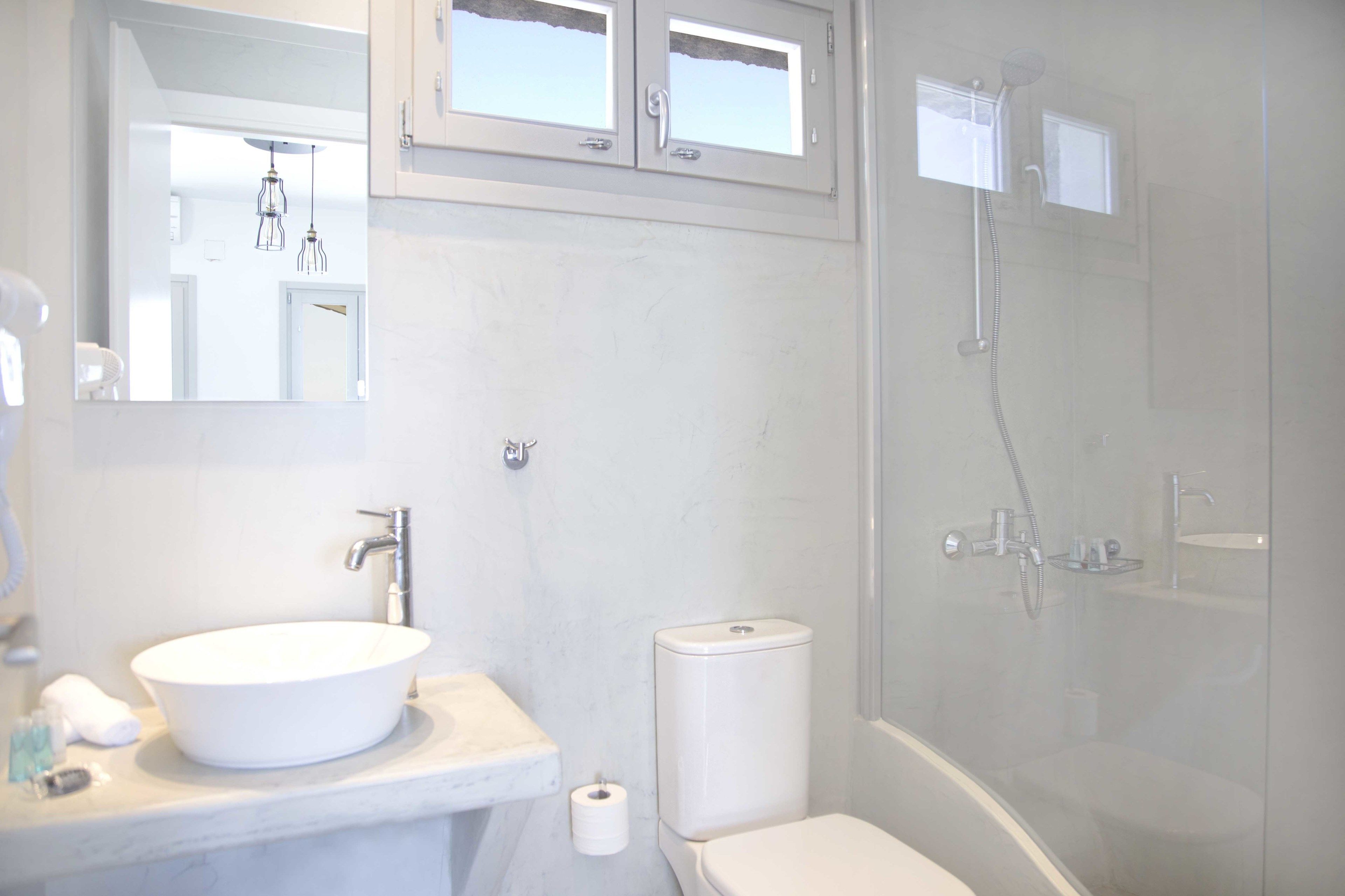 junior suite, sea view | bathroom | shower, eco-friendly toiletries, hair dryer, slippers
