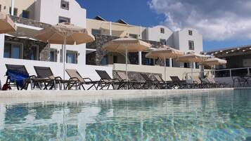 Outdoor pool, pool umbrellas, pool loungers