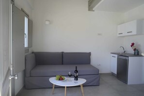 Duplex, Sea View | Living area | Flat-screen TV - Aplai Dome (Santorini)