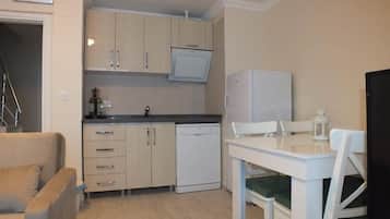 Fridge, stovetop, dishwasher, coffee/tea maker