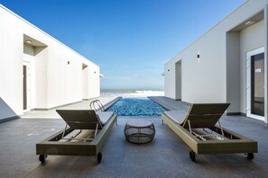 Villa, 4 Bedrooms, Beachfront | Minibar, in-room safe, desk, iron/ironing board