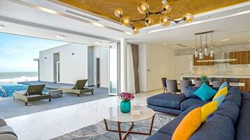 Villa, 4 Bedrooms, Beachfront | Living area | 43-inch LCD TV with cable channels, TV