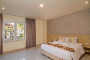 Deluxe Room | Minibar, in-room safe, desk, laptop workspace - Mahalaksmi Boutique Hotel (Denpasar)
