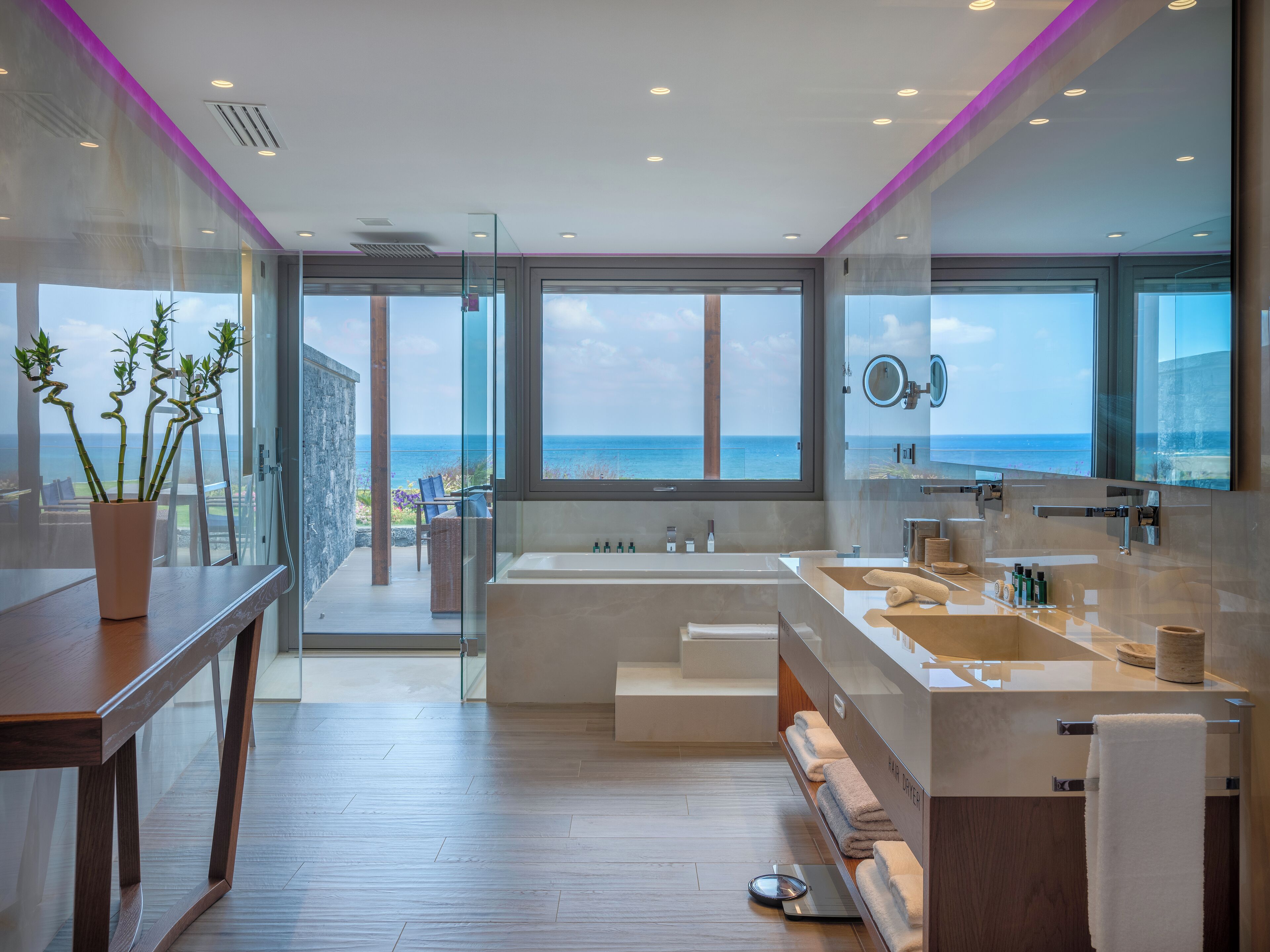 premium energy suite sea view with private pool and soulsauna | bathroom | separate bathtub and shower, deep-soaking bathtub, rainfall showerhead