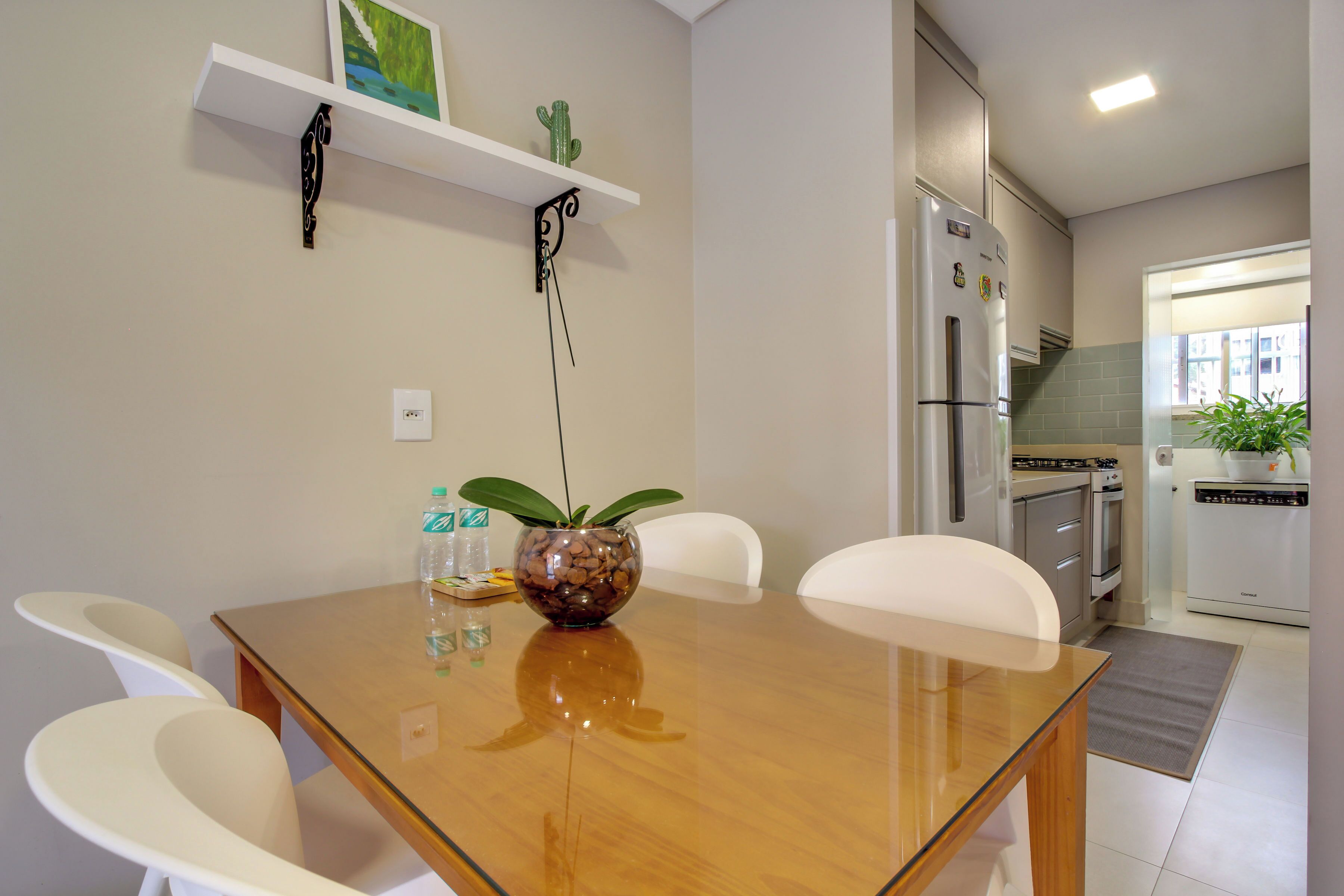 A modern kitchen with a refrigerator, oven, and dishwasher.