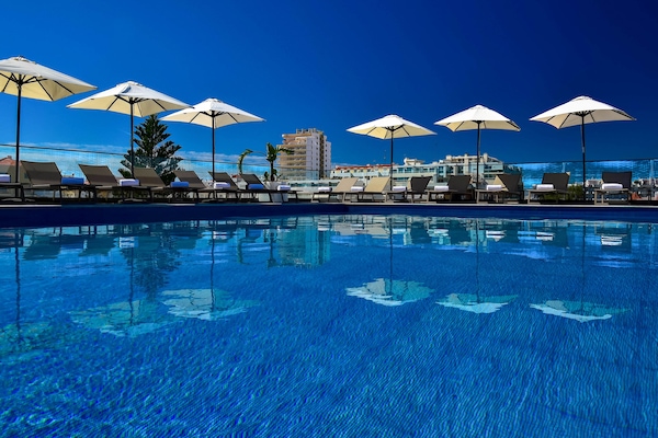 Indoor pool, outdoor pool, pool umbrellas, sun loungers