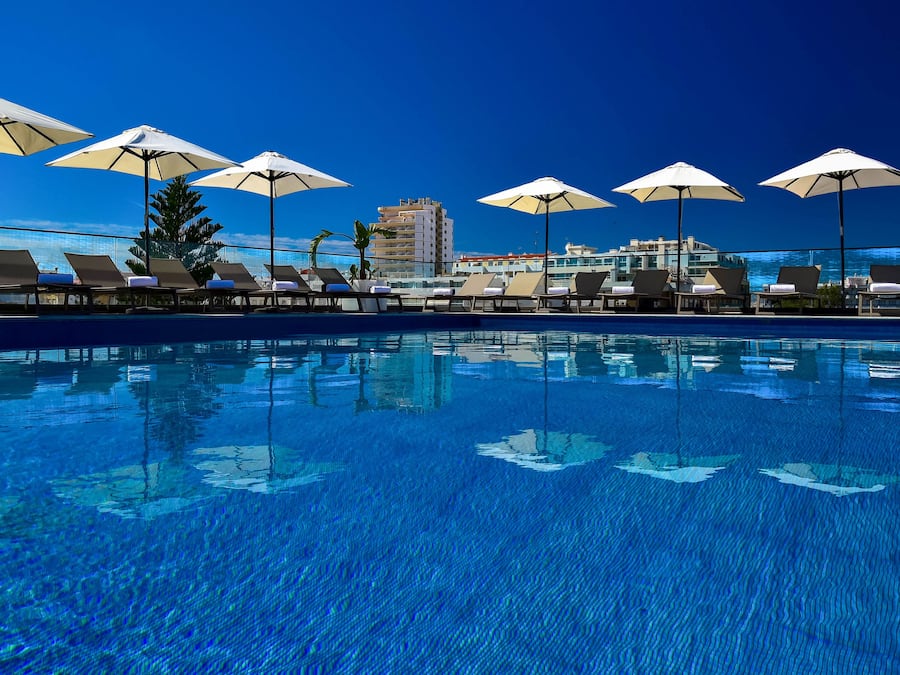 Indoor pool, outdoor pool, pool umbrellas, sun loungers