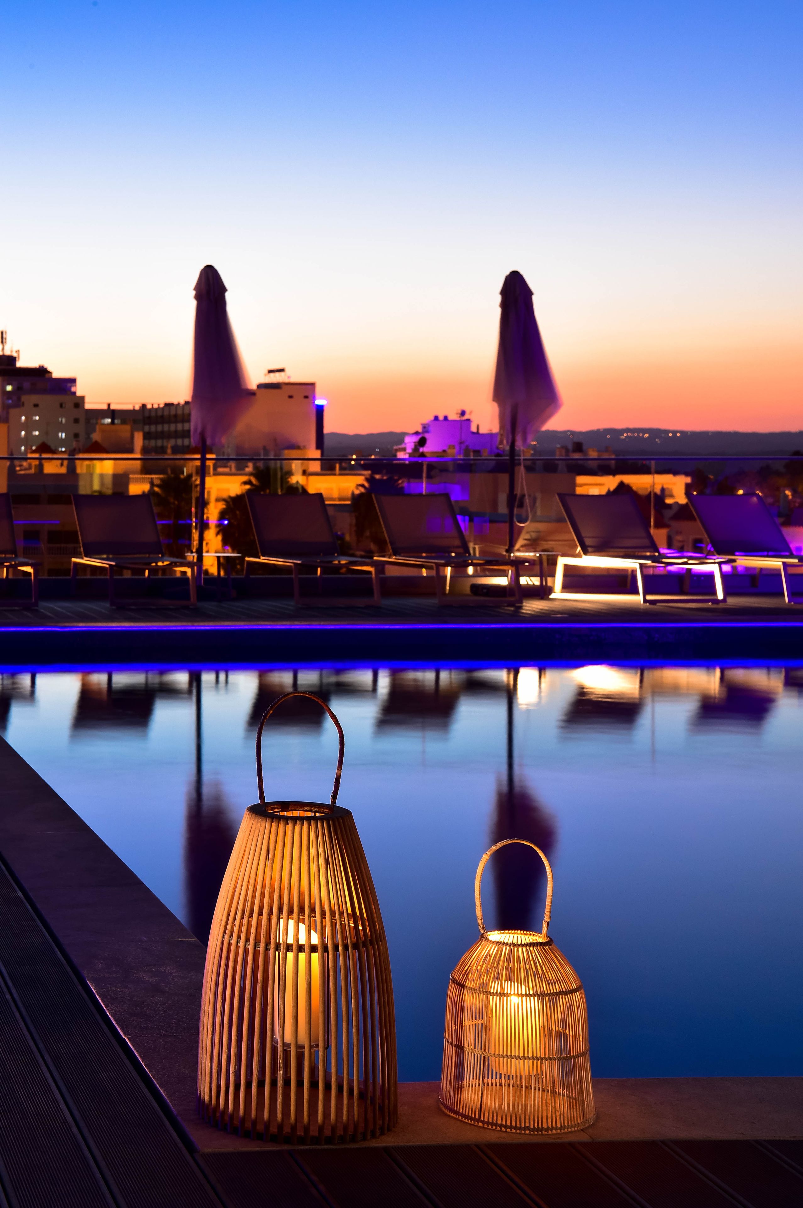 indoor pool, outdoor pool, pool umbrellas, pool loungers