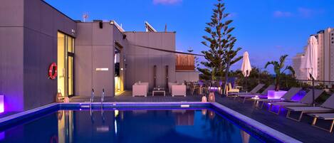 Indoor pool, outdoor pool, pool umbrellas, pool loungers