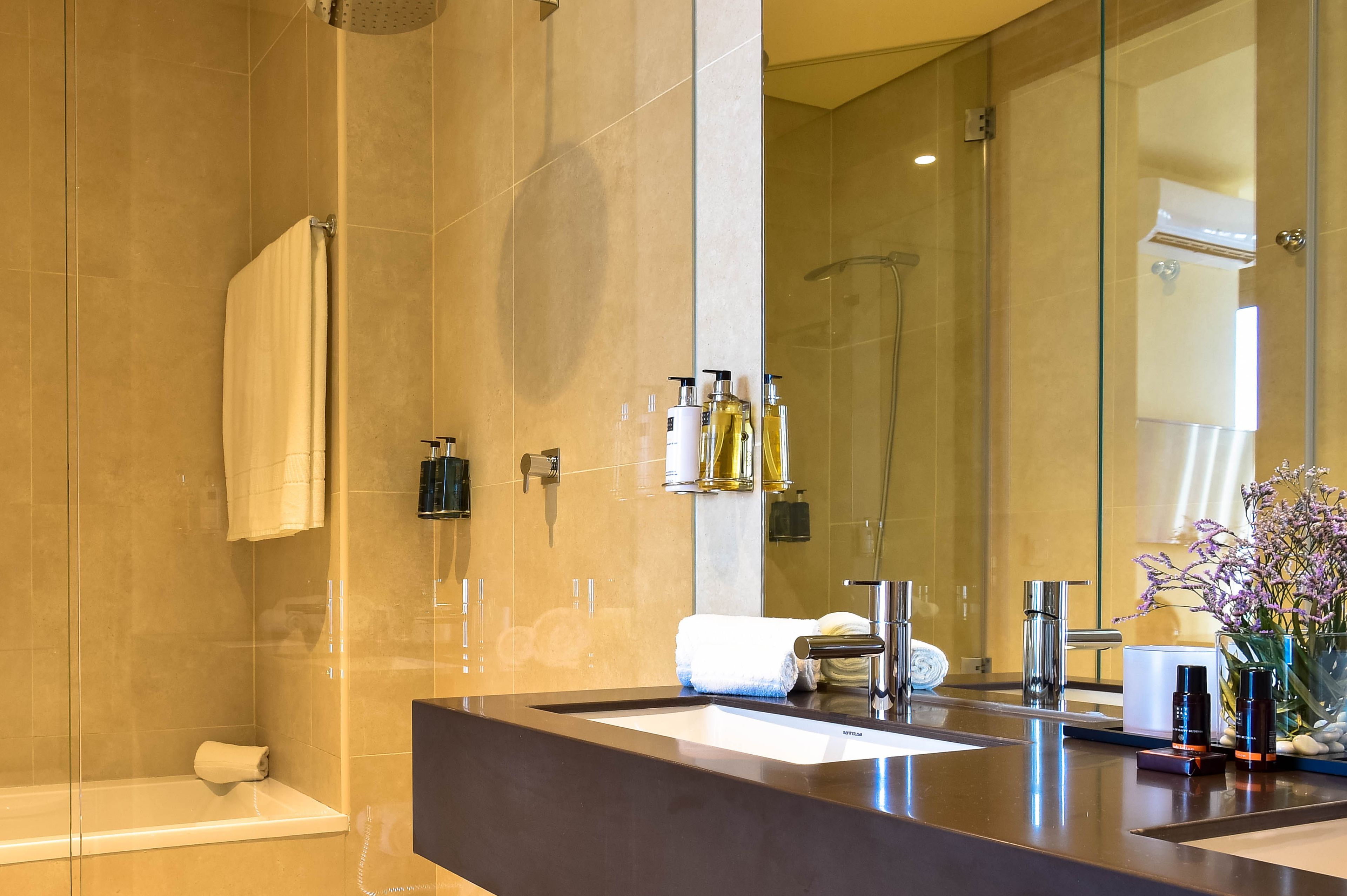 designer toiletries, hair dryer, bidet, towels