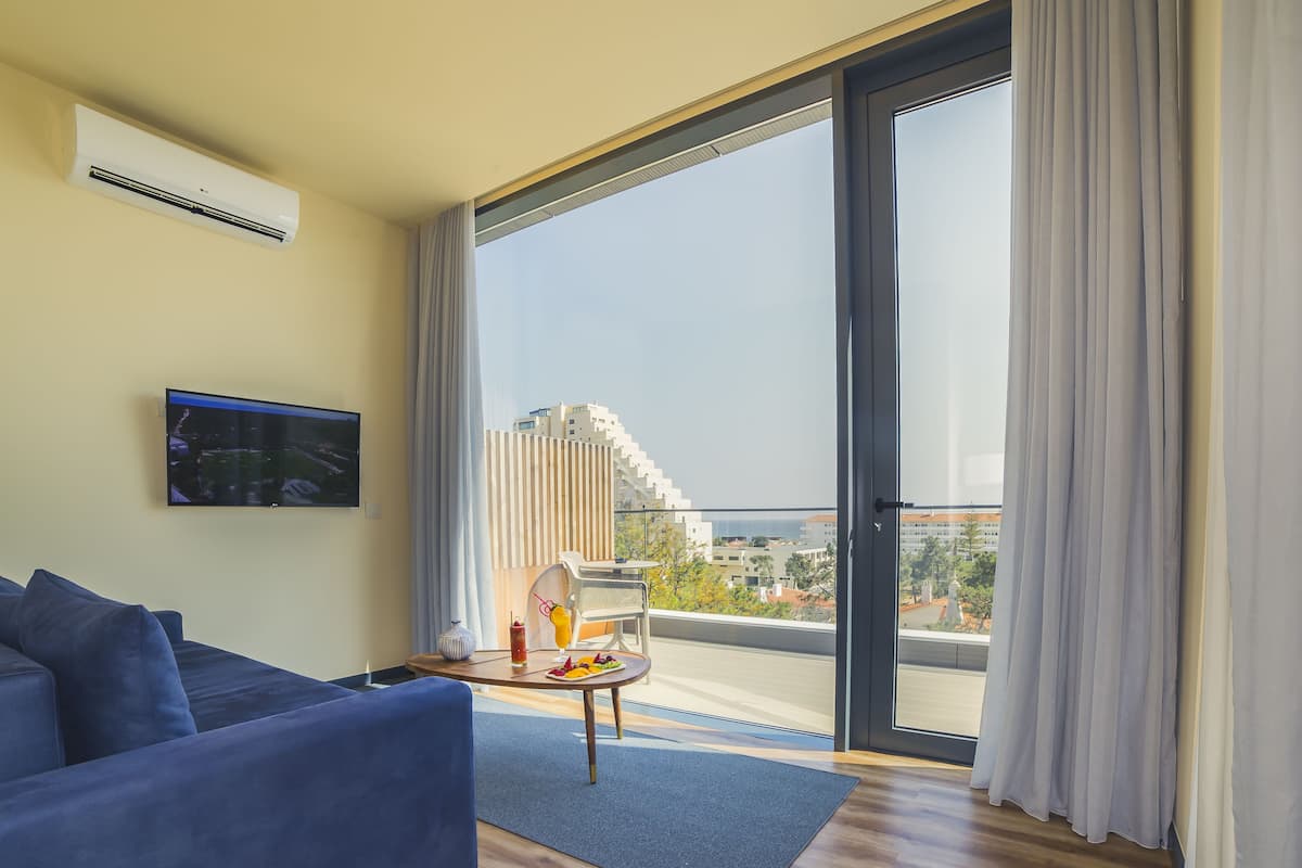 Deluxe Suite, Sea View | Hypo-allergenic bedding, minibar, in-room safe, desk