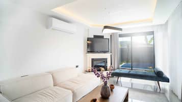 Villa | Living area | 108-inch Smart TV with satellite channels, Netflix, streaming services