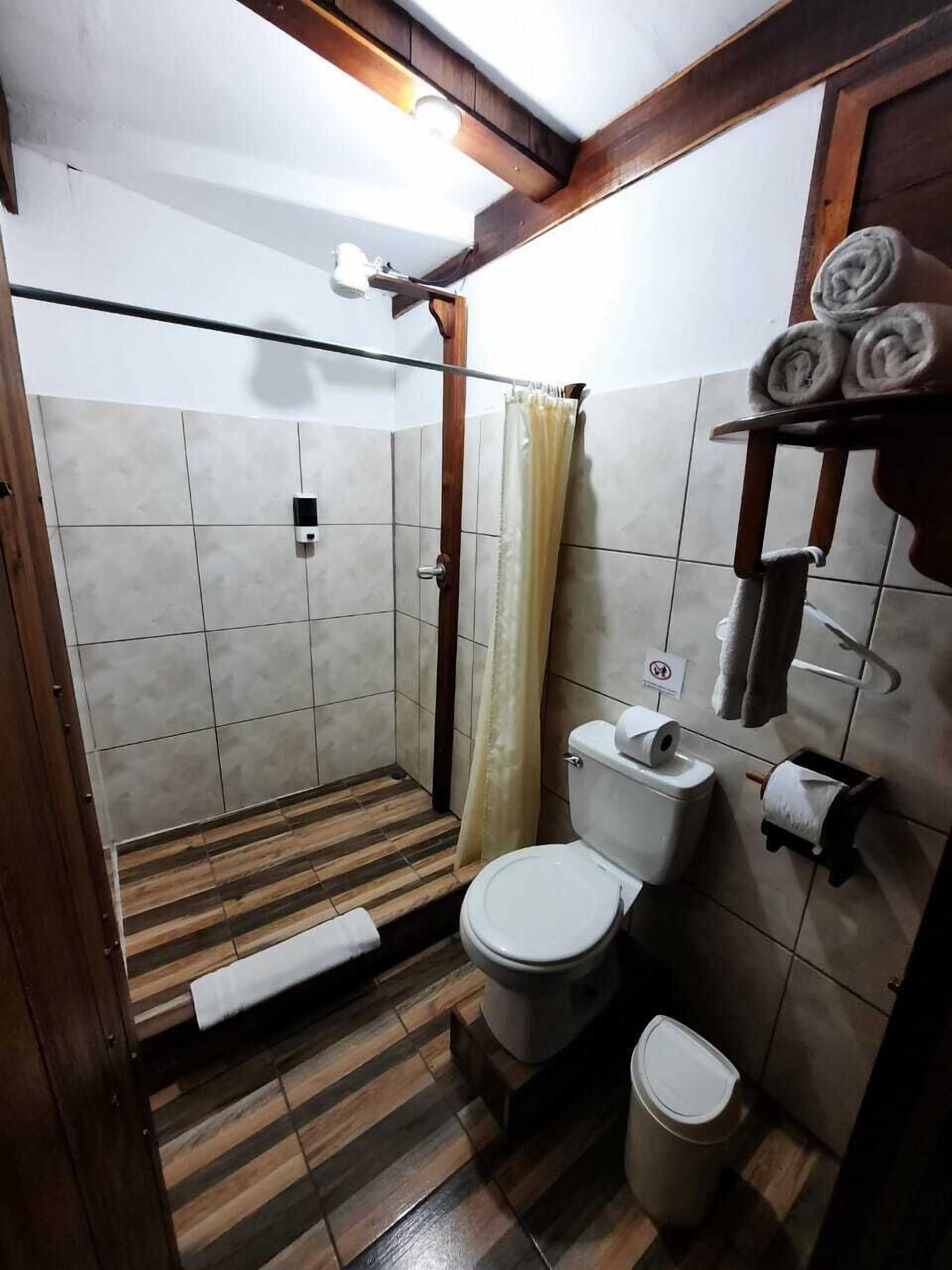 superior room | bathroom | shower, free toiletries, hair dryer, towels