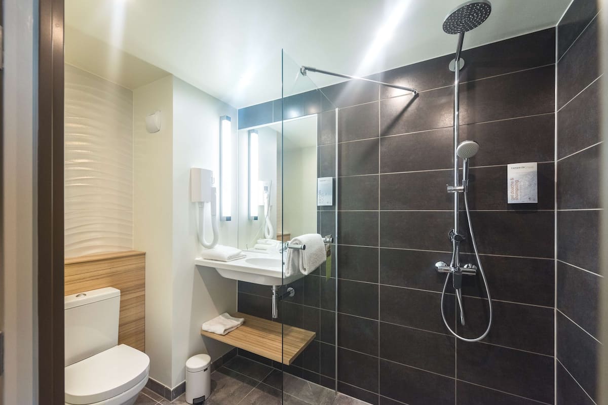 eco-friendly toiletries, hair dryer, towels