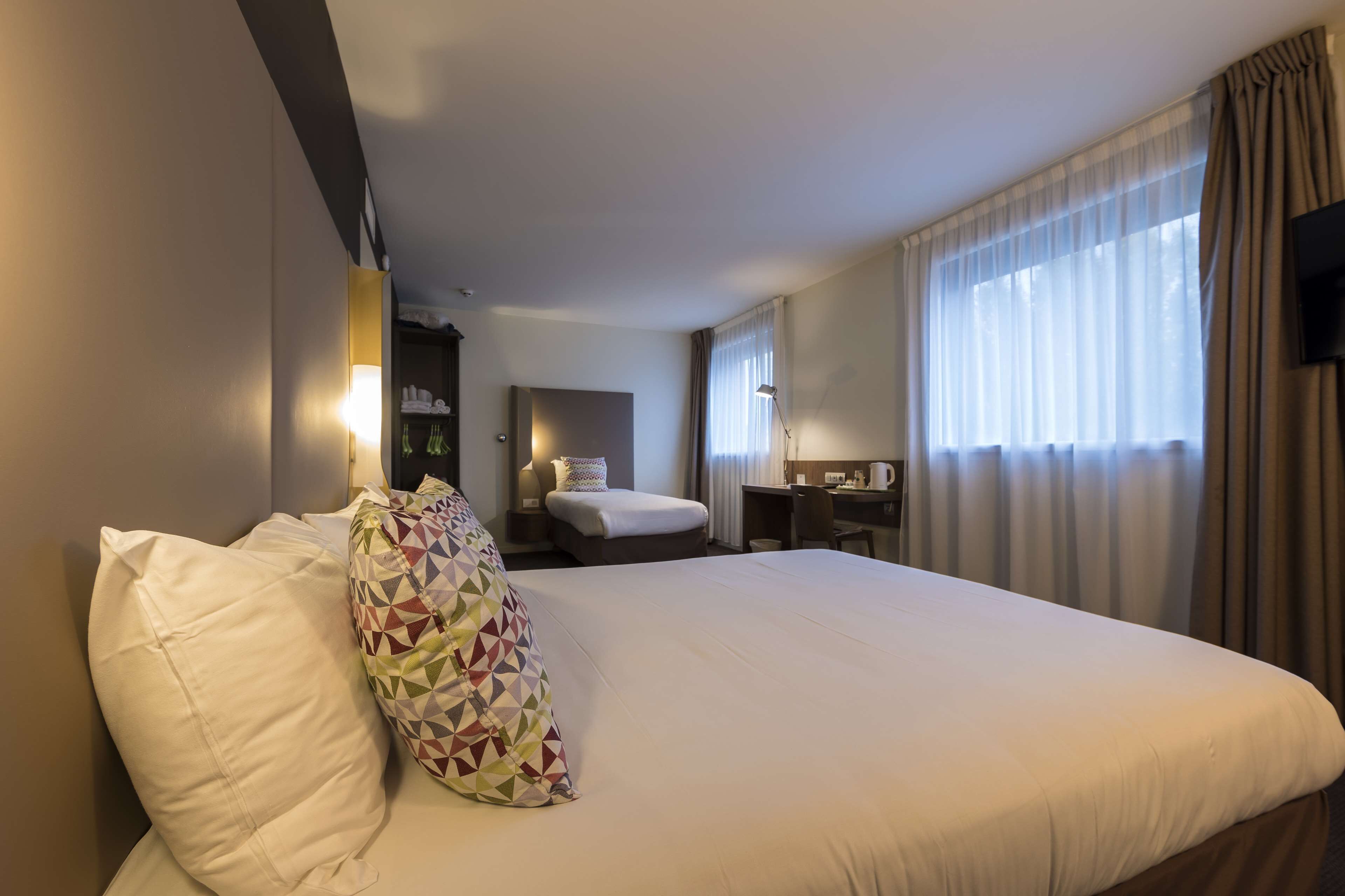 Standard Room, Multiple Beds | Premium bedding, individually furnished, desk, laptop workspace