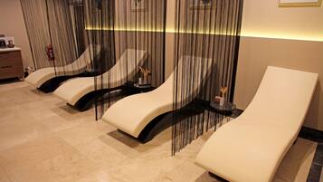 Relax in style with our spa area featuring three reclining chairs and side tables.