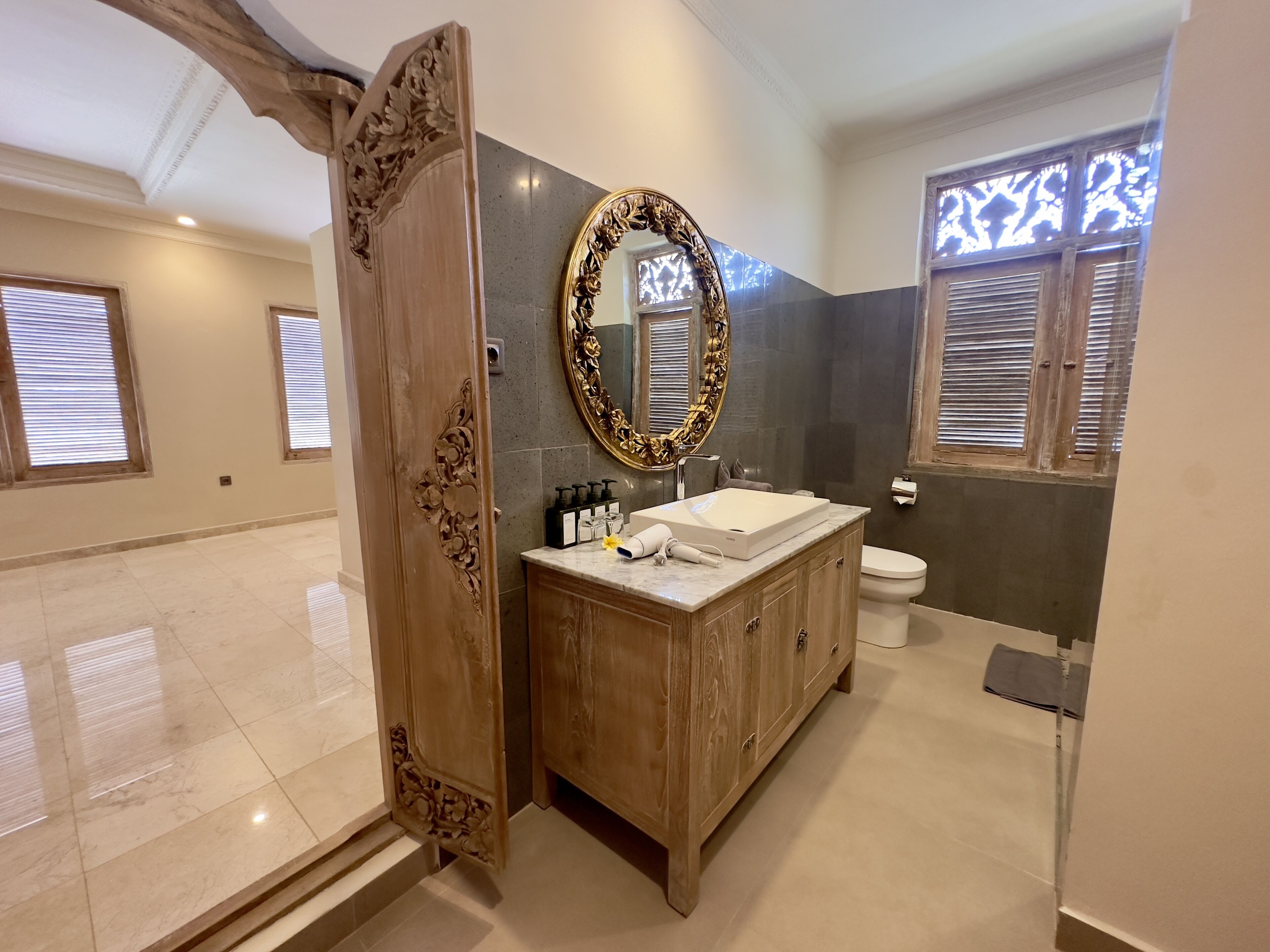 deluxe studio | bathroom | separate bathtub and shower, rainfall showerhead, towels, soap