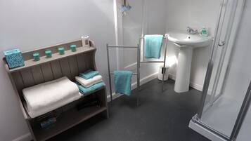 Shower, hair dryer, towels, soap