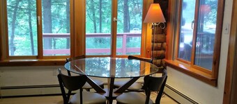 Waterfont log home nestled in the pines