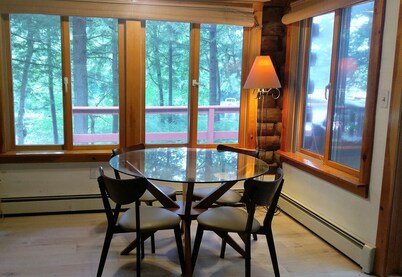 Waterfont log home nestled in the pines
