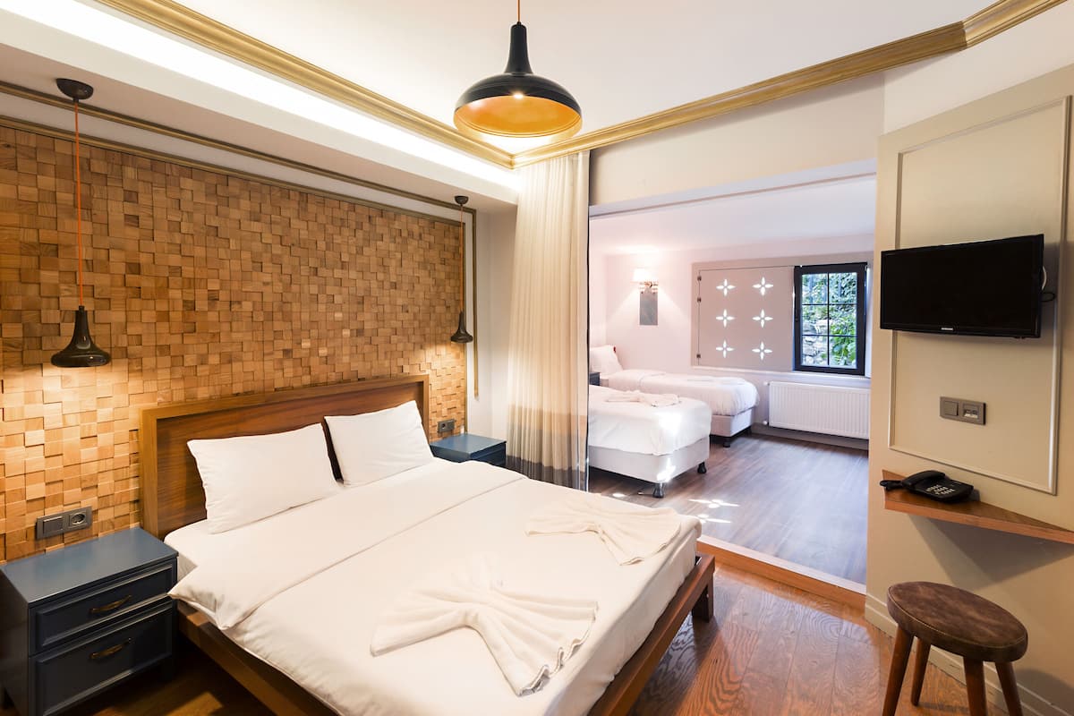 Family Quadruple Room, Multiple Beds | Premium bedding, minibar, in-room safe, desk