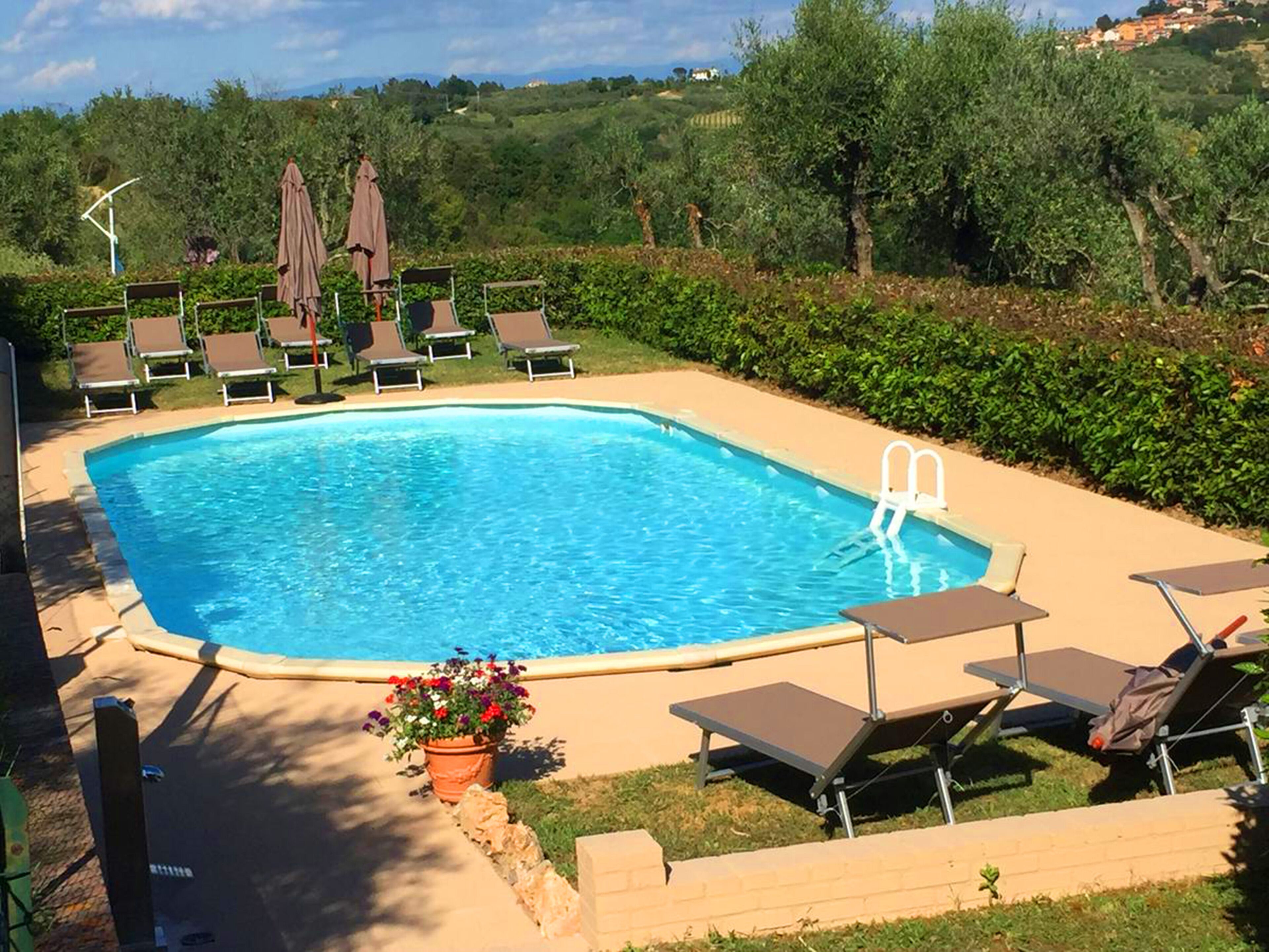 Seasonal outdoor pool, open 8:00 AM to 7:30 PM, pool umbrellas