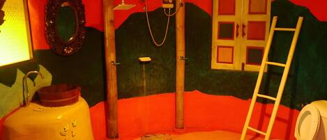 A bathroom with a toilet, sink, and shower.