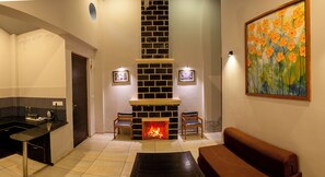 The Premia Two Bedroom Villa  | Living area | 32-inch TV with satellite channels, fireplace, table football - LaTigre Resort (Salt)