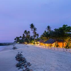 On the beach, white sand, sun-loungers, beach umbrellas