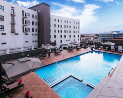 Outdoor pool, pool umbrellas, sun loungers