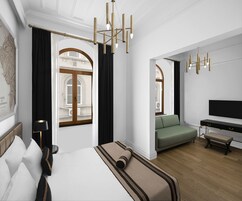 A modern hotel room with a large bed, a sofa, a desk, and a television.