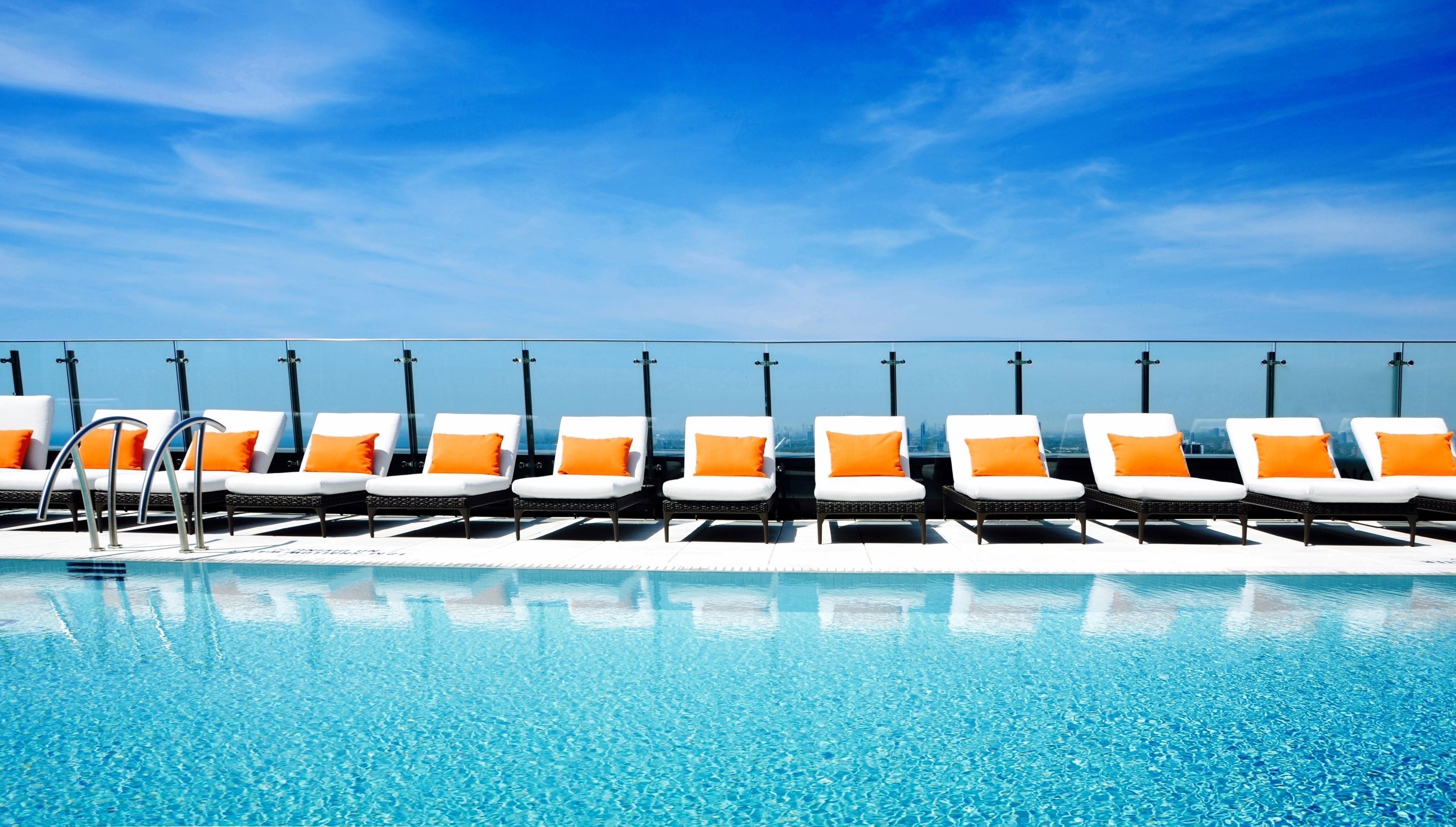 Outdoor pool, a heated pool, open 7:00 AM to 11:00 PM, pool loungers