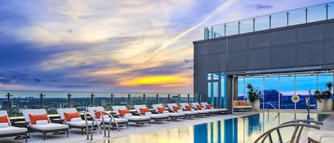 Outdoor pool, a heated pool, open 7:00 AM to 11:00 PM, sun loungers