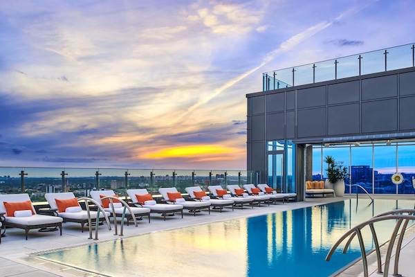 Outdoor pool, a heated pool, open 7:00 AM to 11:00 PM, pool loungers