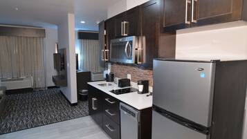 Fridge, microwave, coffee/tea maker, cookware/dishes/utensils