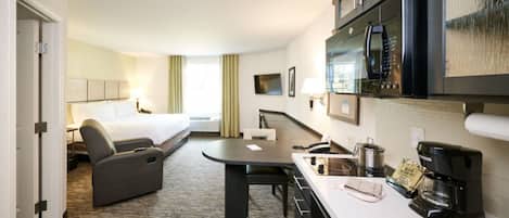 Hypo-allergenic bedding, desk, laptop workspace, blackout drapes