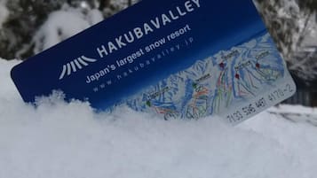 A blue sign with the text "Hakubavalle Japan's largest snow resort" and a map of the resort.