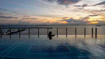 Outdoor pool, open 7:00 AM to 7:00 PM, pool loungers