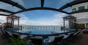 Outdoor pool, open 7:00 AM to 7:00 PM, pool loungers