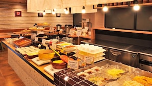 A buffet with various food items and serving utensils. - Matsumoto Tourist Hotel (Matsumoto)