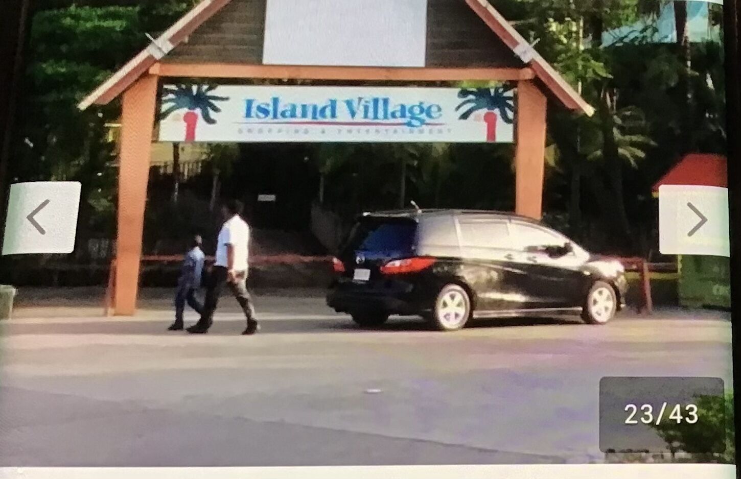 A building with a sign that reads "Island Village".