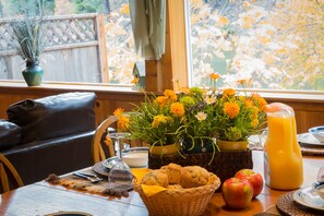 Enjoy a warm breakfast amidst a serene garden view.