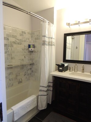Combined shower/bathtub, hair dryer, towels, soap