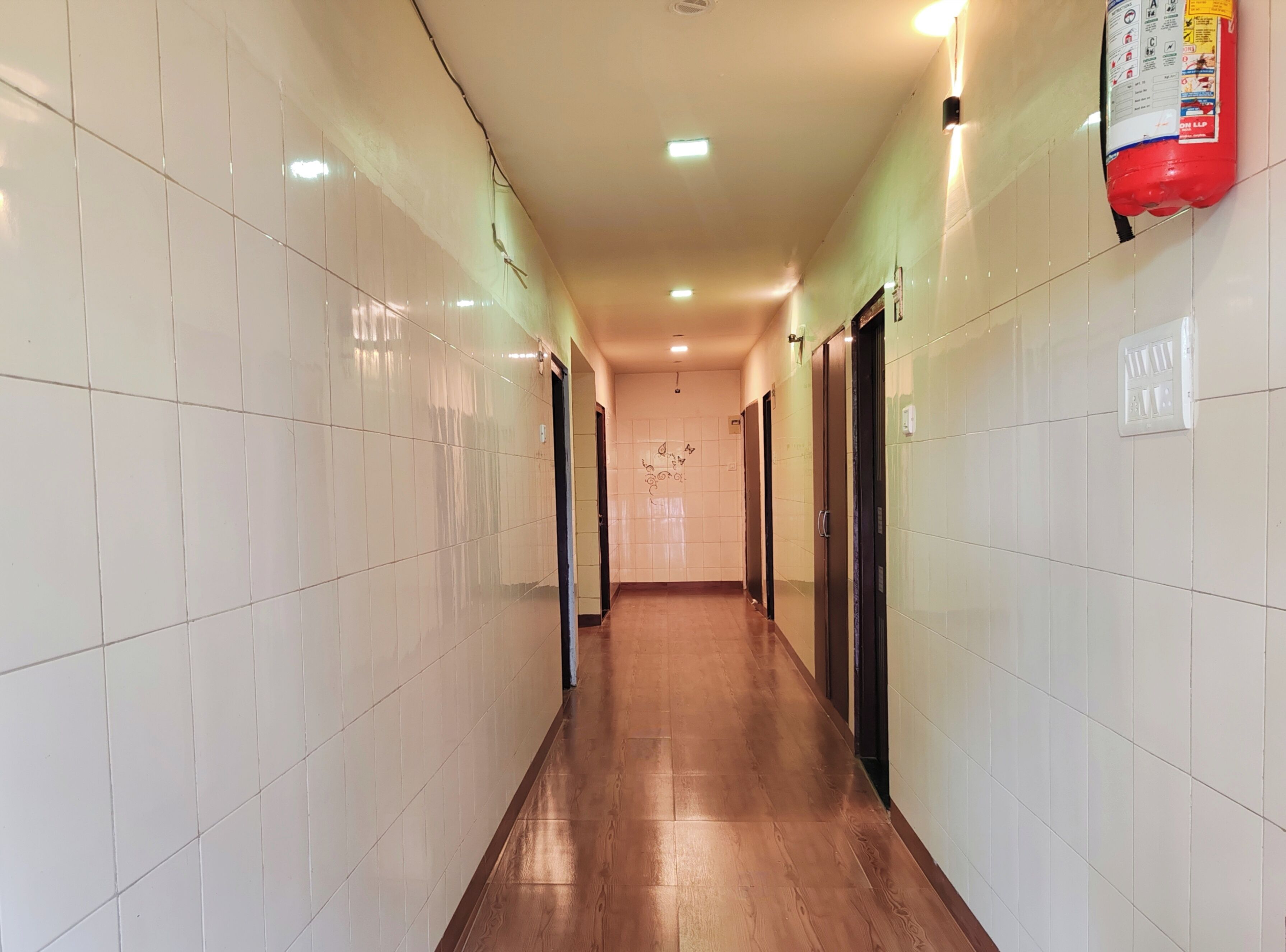 AC Deluxe Room | Living area | 32-inch LED TV with cable channels