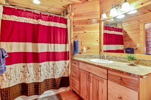 Combined shower/bathtub, hair dryer, towels, soap