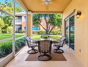 Covered patio with outdoor dining area overlooking the beautifully landscaped g - PGA Village/Castle Pines Best Location Pet Friendly. (Port St. Lucie)