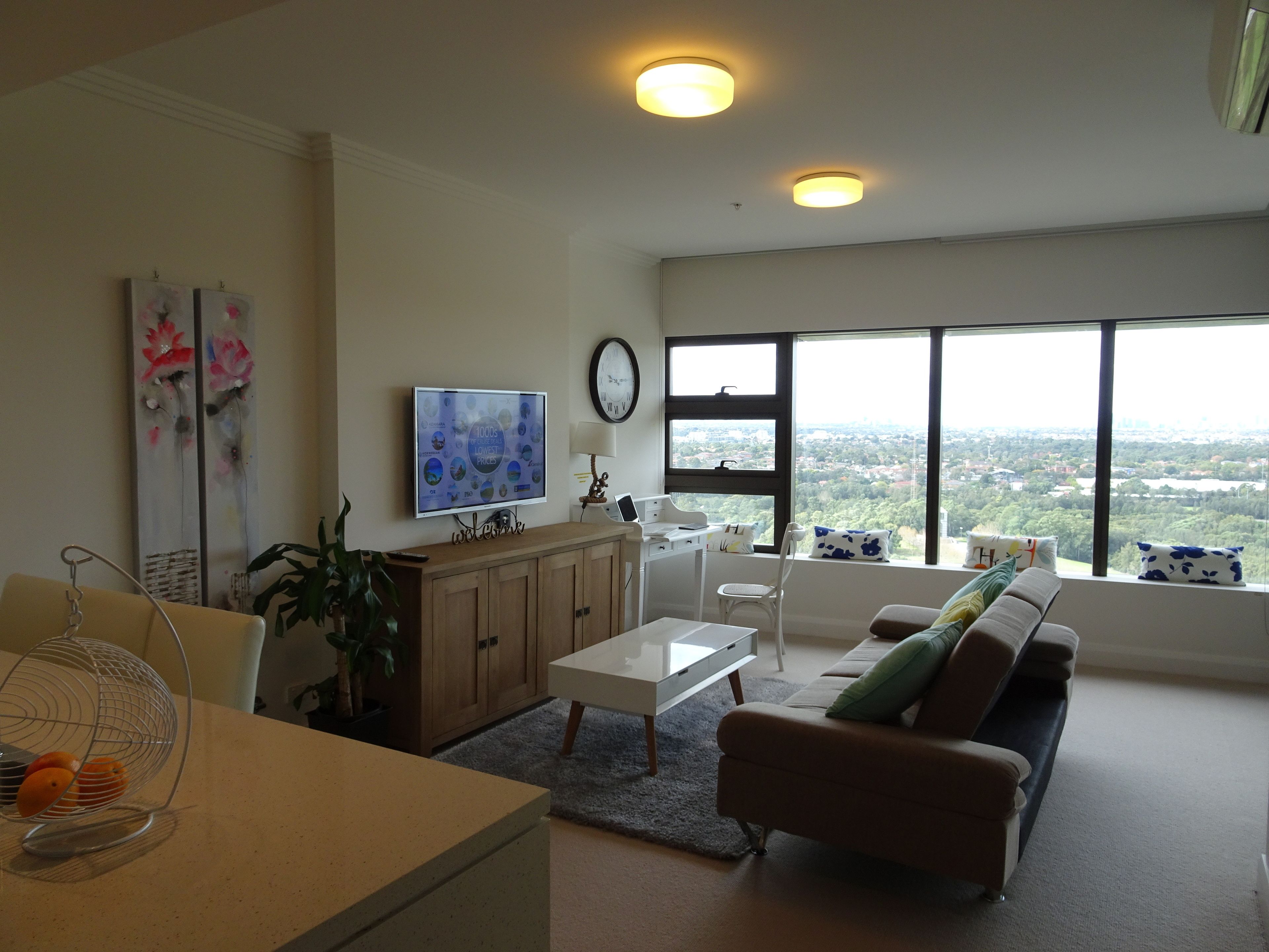 deluxe apartment, 1 bedroom, city view | living area | flat-screen tv