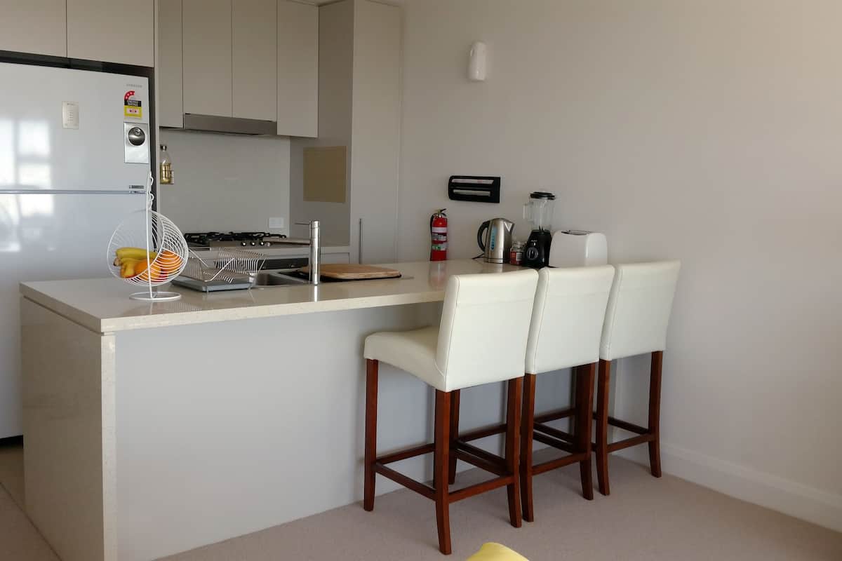 deluxe apartment, 1 bedroom, city view | private kitchenette | full-sized fridge, microwave, oven, stovetop