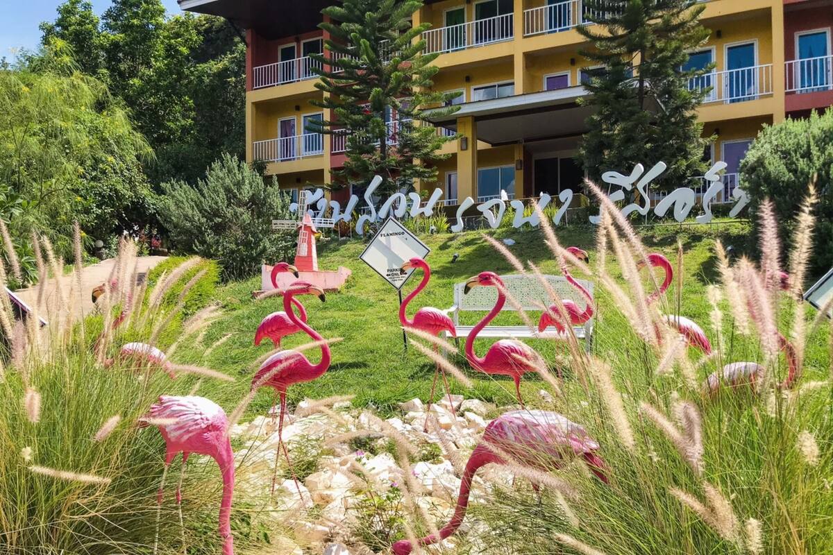 A building with balconies and a sign that reads "Flamingo".